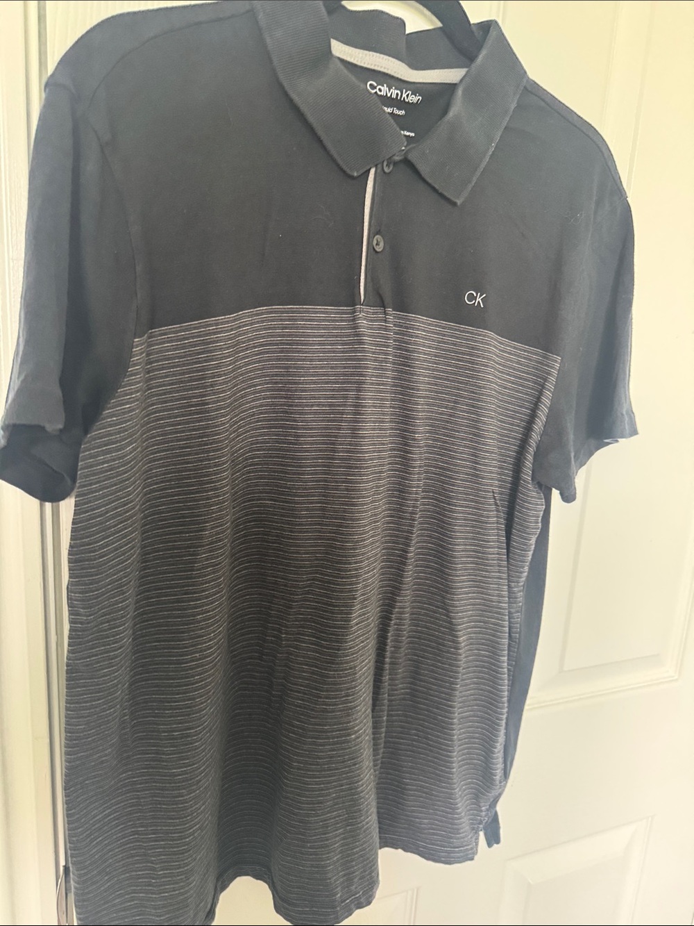 Calvin Klein Men’s Black and Gray Striped Polo